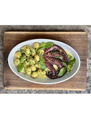 HALF OF A BAKED OCTOPUS WITH POTATOES