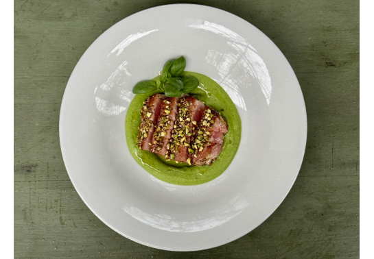 Pistachio-glazed tuna steak with pea-mint sauce